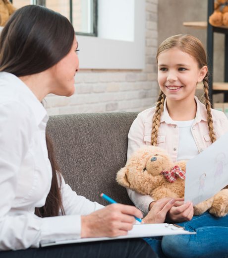 A friendly team member answering a patient's questions