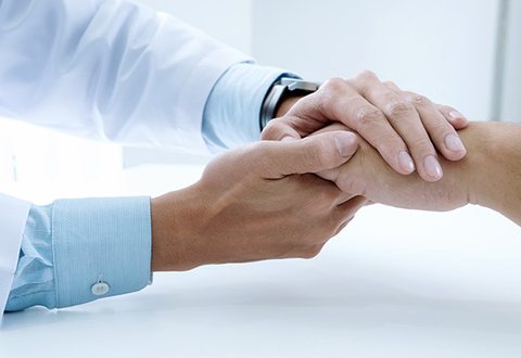 A caring doctor speaking with a patient